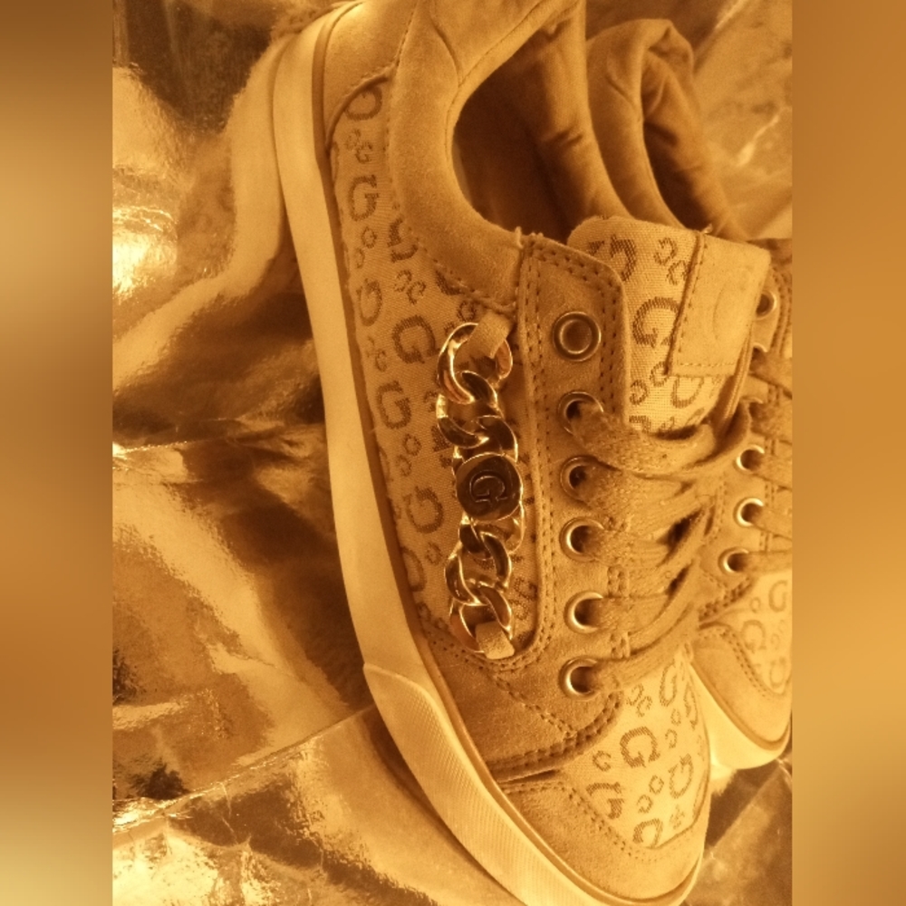 Guess women's gold chain sneakers.